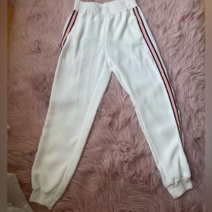 Zara white joggers with black and pink stripes on the side. Has pockets